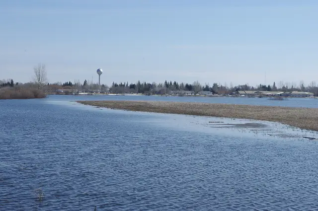 Spring flooding beside the town with water tower